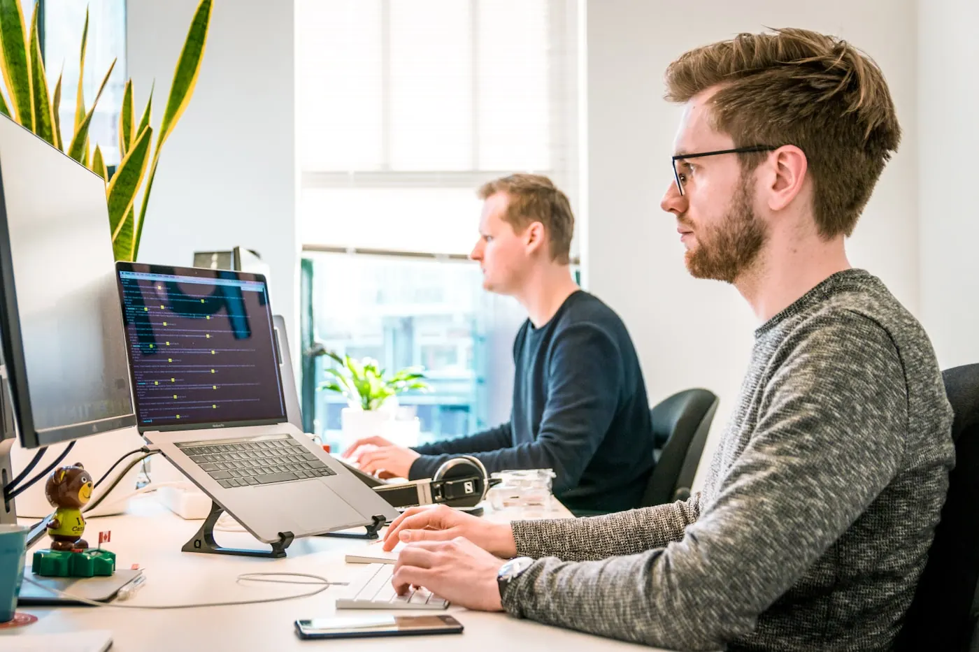 Business team working on automation workflows in an office